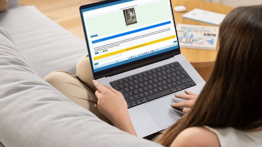 A lady on a sofa using SuperNova to describe family photos